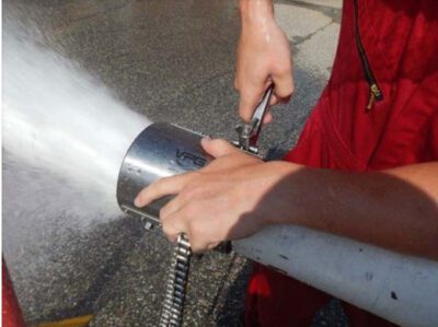 Close up of a worker applying a Rapid Repair Clamp to a bursting pipe